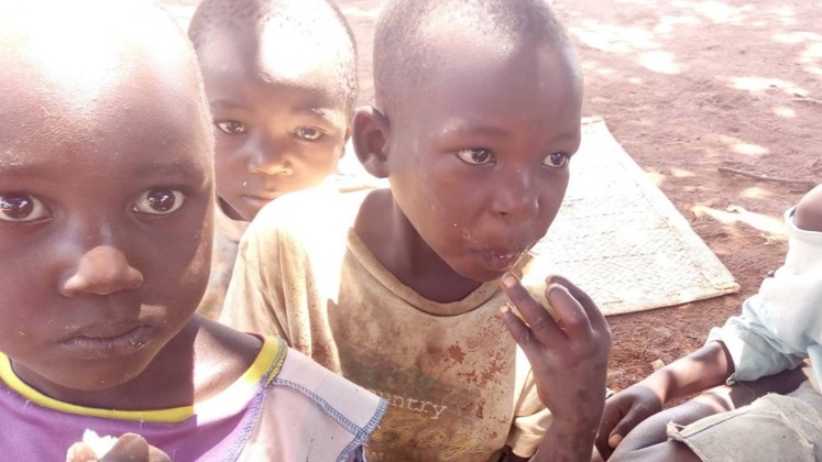 Children and community members sharing a moment during an OGF programme